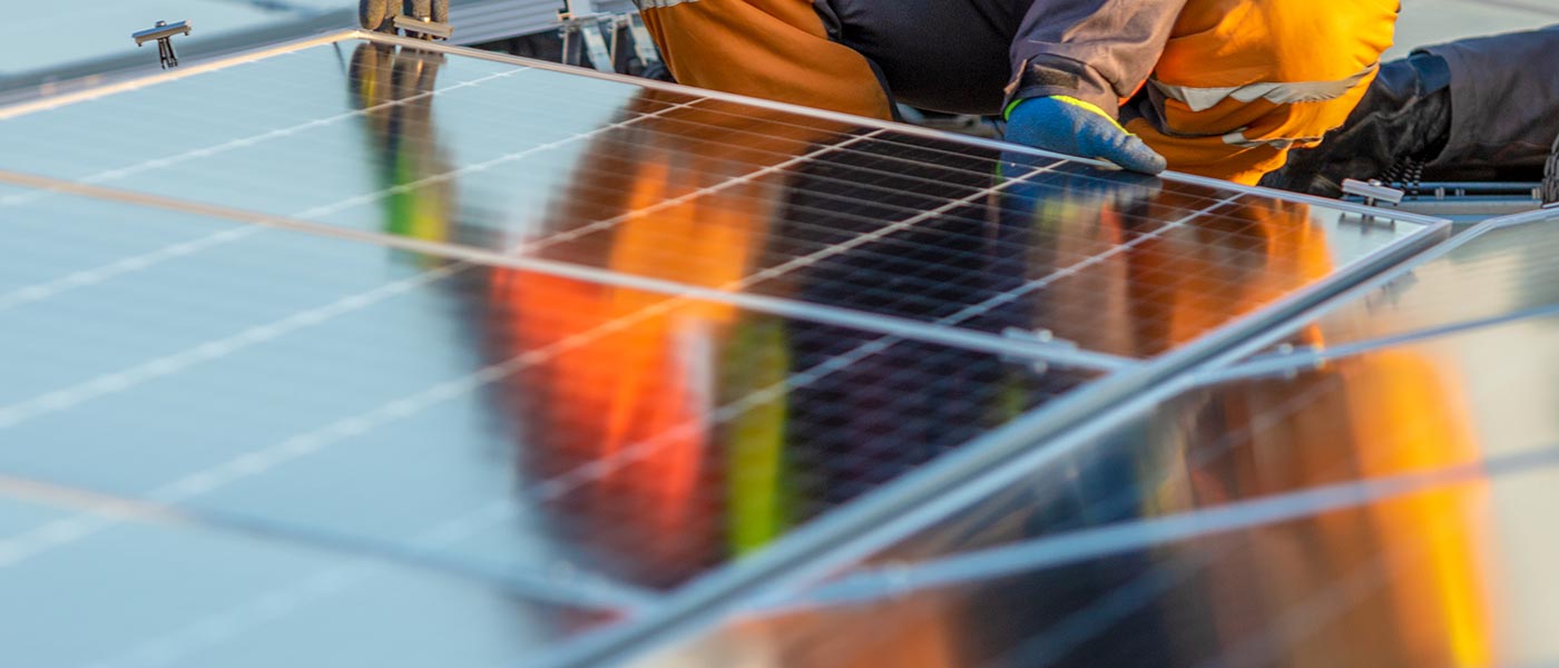 a person working on a solar panel